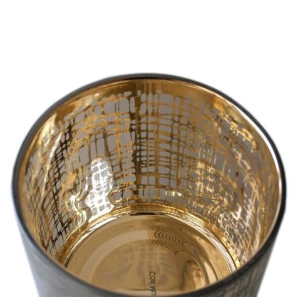 Das Teelicht Nest aus Glas mit goldglänzender Innenseite und gemusterter milchig grauer Außenseite.